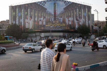 vowed a "firm and appropriate" response. Iran denounces the re-imposition of sanctions