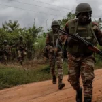 Cotonou witnesses the army's recapture of Benin after a surprise coup attempt.