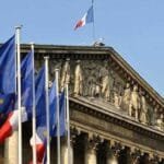 The French government survives a no-confidence test ahead of a budget battle in parliament.
