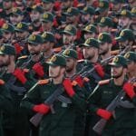 Iran's Revolutionary Guard announces its readiness to respond to America and Israel amid escalating tensions.