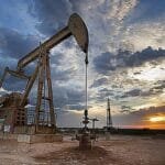 The US embargo forces Venezuela to reduce crude oil production and disrupts shipping.