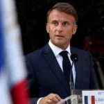 How did French President Macron comment on the burial of the last Israeli hostage in Gaza?