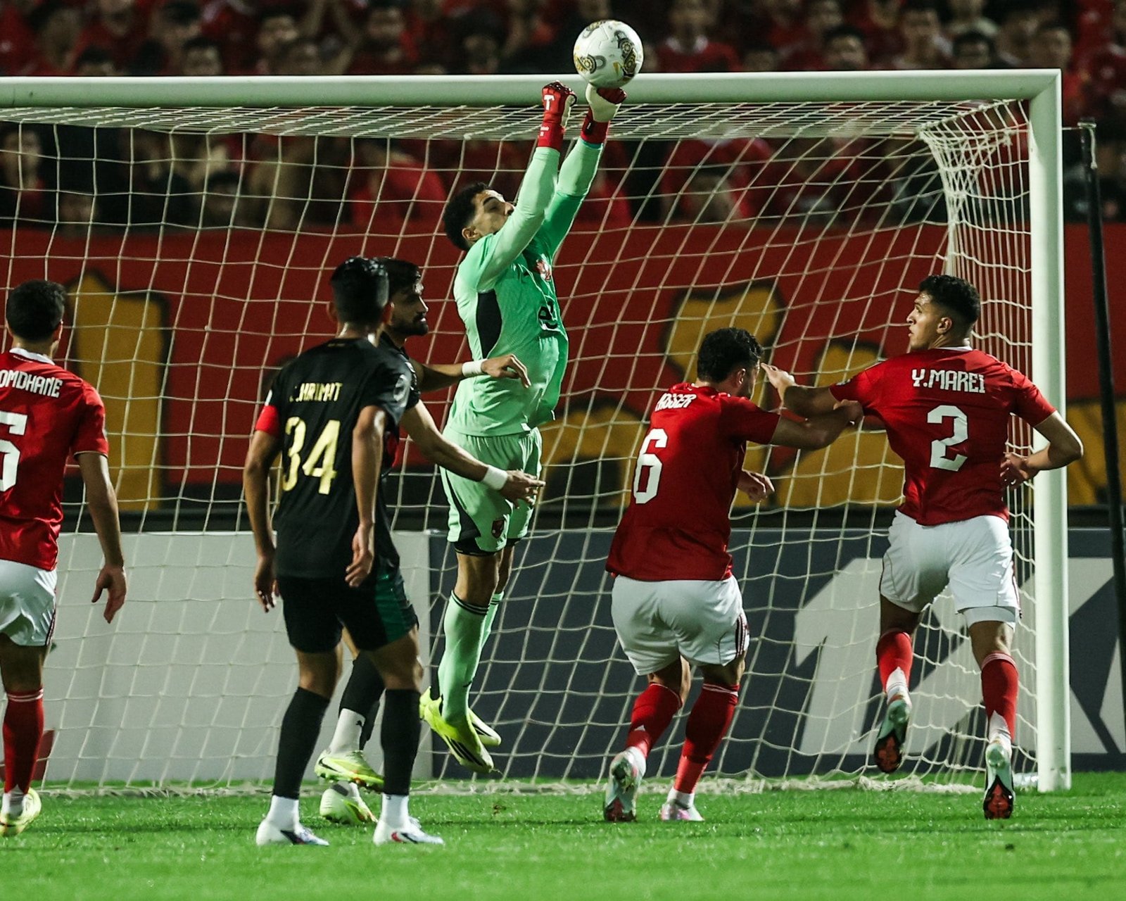 Al Ahly tops its group after a goalless draw against FAR Rabat in the final group stage match