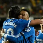 Real Madrid defeats Valencia 2-0 and continues to chase Barcelona for the top spot.