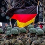 Tensions escalate in Eastern Europe as Germany deploys 5,000 troops and 105 tanks near the Belarusian border.