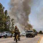 Israeli raid kills a leader in Sidon and Hezbollah responds by shelling Nahariya with rockets