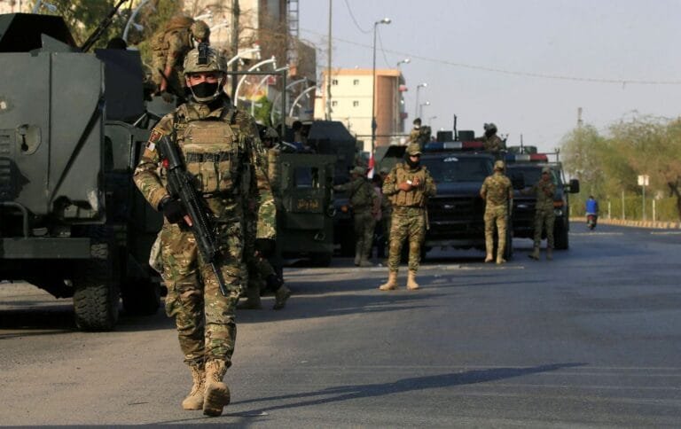 Iraqi security forces shoot down a drone carrying explosives in the skies over Basra.