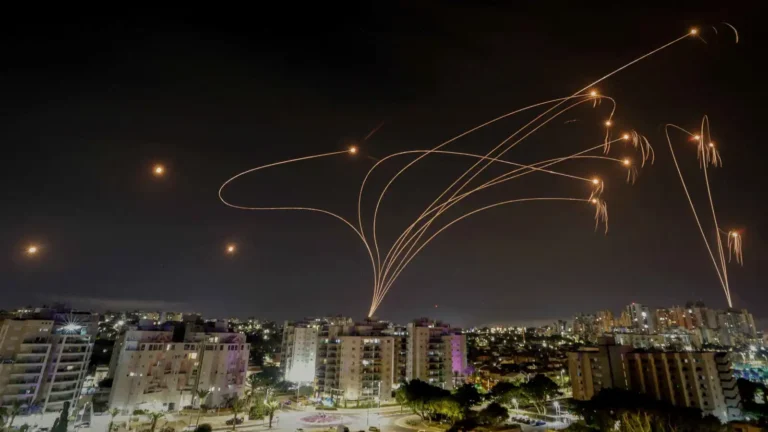 Iranian rocket barrage hits central Israel: Woman injured, street fire breaks out