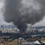 Launching Tomahawk missiles from American warships towards targets in Iran.