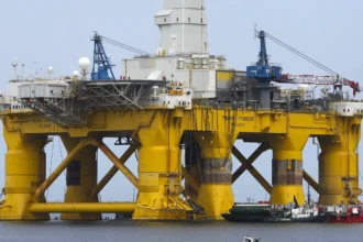 Global oil supply is expected to shrink to 12.8 million barrels per day amid warnings of market volatility.