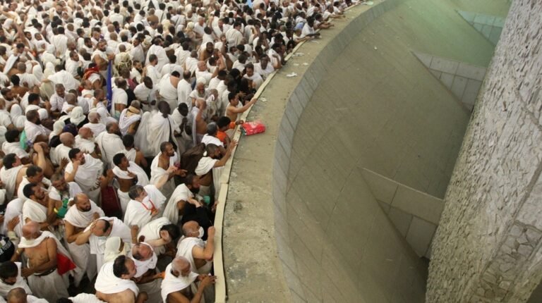 Pilgrims perform the stoning of the Jamarat al-Aqaba on the Day of Sacrifice amidst a spiritual atmosphere and intensive organization