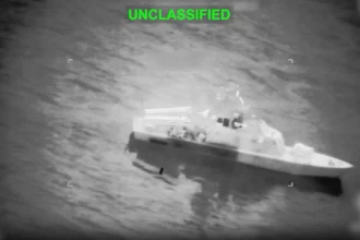 A mysterious missile strikes a container ship in the Strait of Hormuz; crew members injured, international concerns escalate