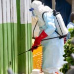 Specialized medical staff wearing biological protection clothing