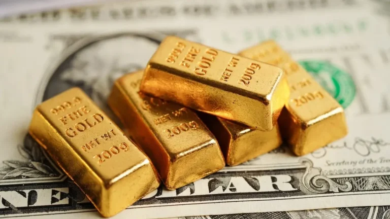 The dollar's decline and falling oil prices are driving gold higher following Washington's recent decisions