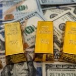 Gold prices fell globally, while the dollar stabilized as the world awaited US monetary policy