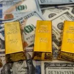 Gold prices fell globally, while the dollar stabilized as the world awaited US monetary policy