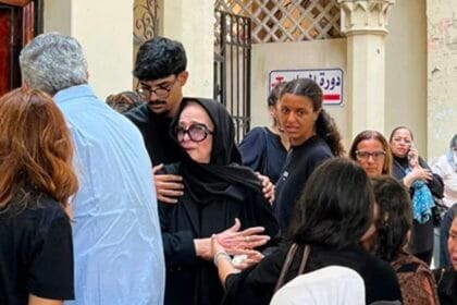 Naglaa Fathy bids farewell to her daughter, Yasmine Abu El-Naga, as she is laid to rest.