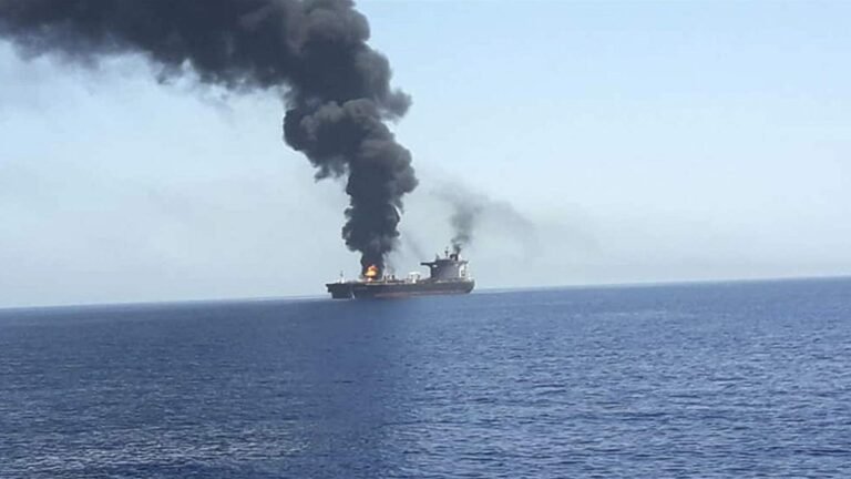 An oil tanker was hit by an unidentified projectile off the coast of Oman amid escalating tensions in the Strait of Hormuz