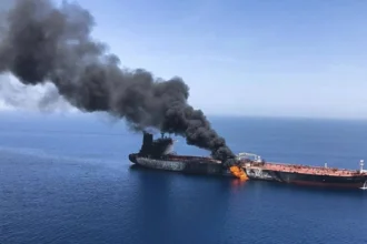 The British Navy announces that a cargo ship was hit by a projectile in the Strait of Hormuz
