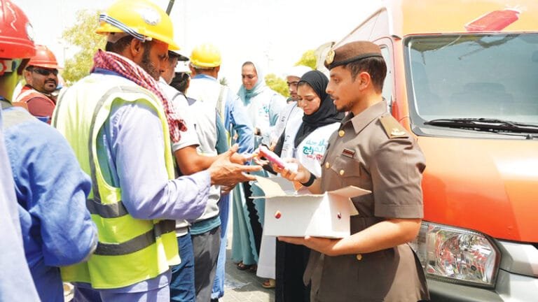 The third edition of the "Al-Freij Refrigerator" initiative.. Dubai Residence distributes 58,000 packages of cold water, juices and ice cream to workers